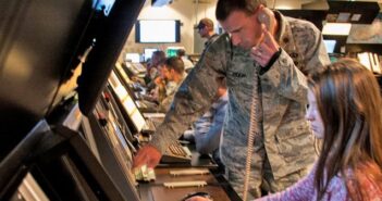 Students preview dream job at Eglin Academy Tiffany Berkely, Crestview High School 10th grade student, experiences what it is like to be an air traffic controller the help of Maj. Mark Oden, 96th Operations Support Squadron flight commander, at the Eglin Range Control Facility. As part of the lesson plan for the 96th TW Academy, a base mentoring program and Affirmative Employment Program initiative, Berkely’s mentor, Latanya Bryant, 96th TW chief of financial management, shared her year-long experience of managing a team of budget analysts in calculating costs of meeting a mission need for a new air traffic control system from the initial concept, through construction, upgrading technology and current operation. (U.S. Air Force photo/Chrissy Cuttita)