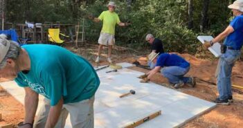 Kiwanis of Niceville-Valparaiso build patio for kids niceville kiwanis club members building patio