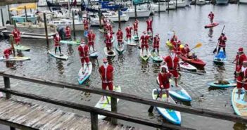 Santa Paddle Parade raises $540 for Sharing & Caring santas on paddleboards at Bluewater Marina in Niceville 2019