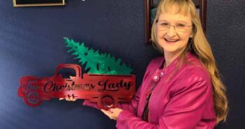 Rotary Club honors Debbie Lewis for Christmas Parade work debbie lewis niceville valparaiso rotary club with award