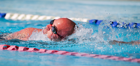 Jason Caswell, an Air Force Wounded Warrior athlete, swims laps during the fourth day of the Warrior Games training camp at Eglin Air Force Base, Fla