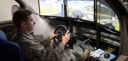 William Schweitzer, 96th Logistics Readiness Squadron, demonstrates the unit’s driving simulator.