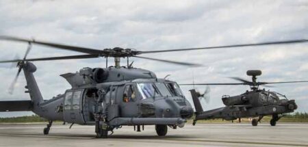 HH-60W Jolly Green II taxies in followed by an AH-64 Apache May 19 at Eglin Air Force Base, Fla.