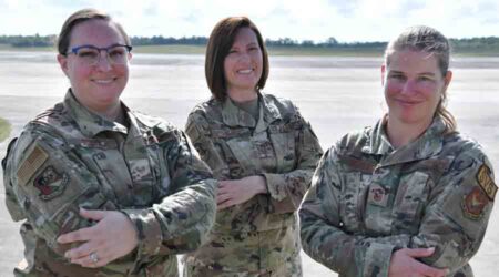 Staff Sgt. Kaydee Goleta, 919th Special Operations Force Support Squadron management lead, Senior Master Sgt. Tanya Kent, 919th Special Operations Maintenance Squadron superintendent, and Senior Master Sgt. Renee Gould, 919th SOFSS sustainment services flight chief, take a moment to pose for a group photo at Duke Field