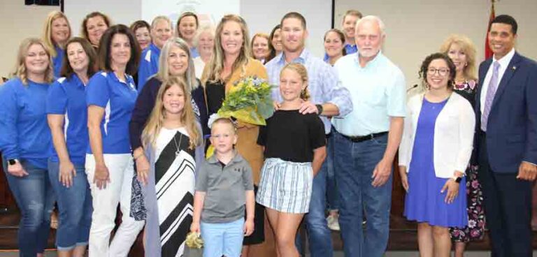Melissa Kearley with family, friends, and Okaloosa County School District officials.