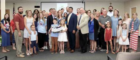 Allyson LaVictoire with family, friends, and school district officials following her appointment as principal at Riverside Elementary School