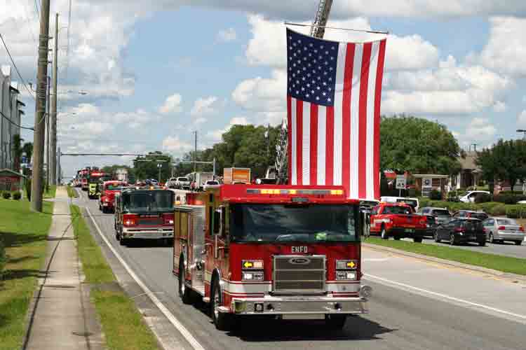 Firefighters from throughout the area honor former fire chief Mike Wright in Niceville and Valparaiso with a fire truck procession