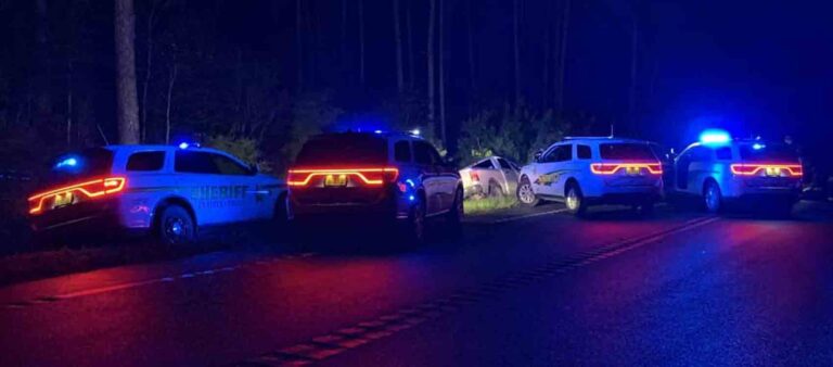 arrest scene near Holt with four patrol cars and pickup truck