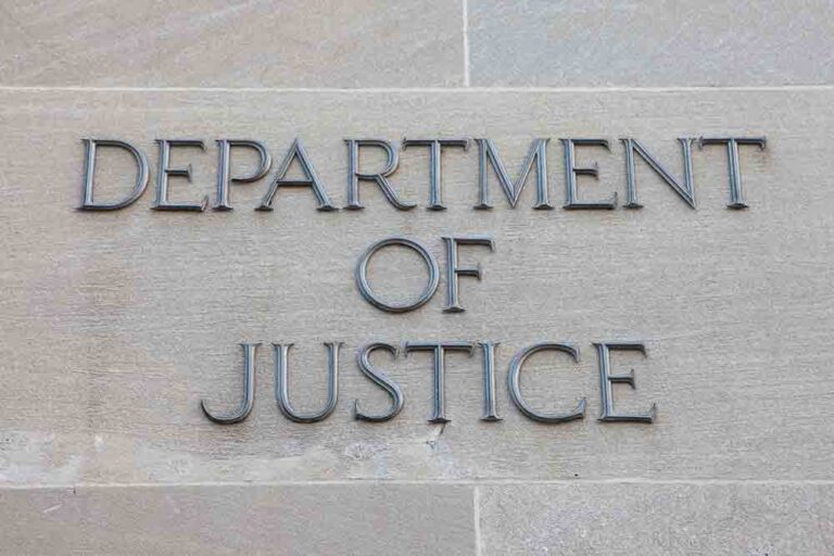U.S. Department of Justice sign on building.