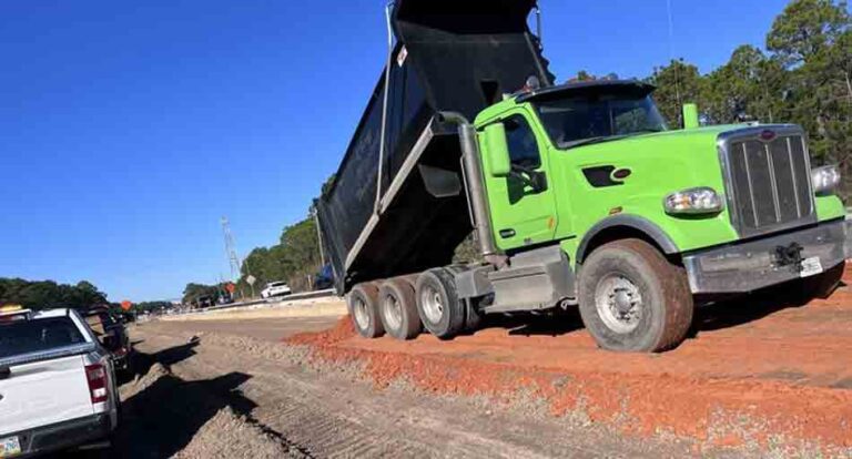 dump truck dumping sweetener clay material