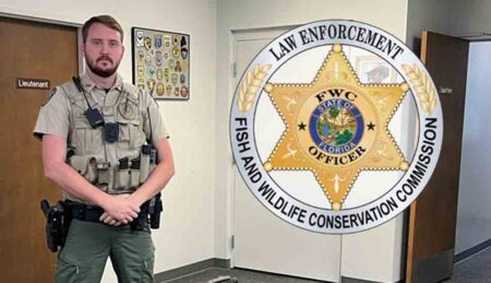 Florida Fish and Wildlife Conservation Commission officer standing indoors