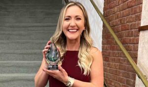 Natalie Davis holding her 2022 Young Professional of the Year award.