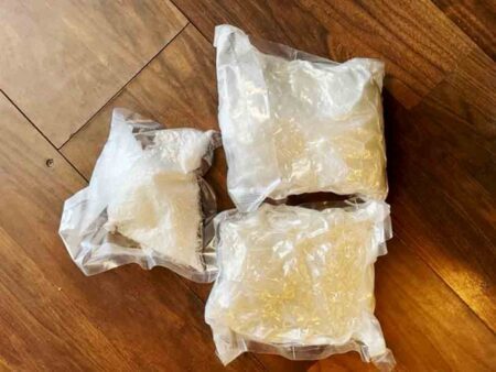 three clear bags containing crystal methamphetamine, heroin