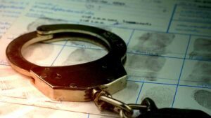 Handcuffs on fingerprints crime page file