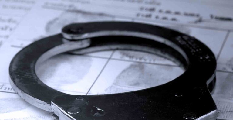 Handcuffs on fingerprints crime page file