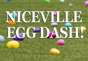 colorful plastic easter eggs on tidy green grass with Niceville Egg Dash title.