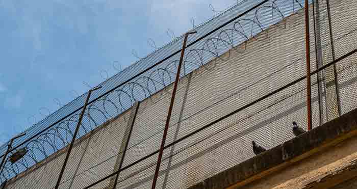 prison wall with barbed wire,
