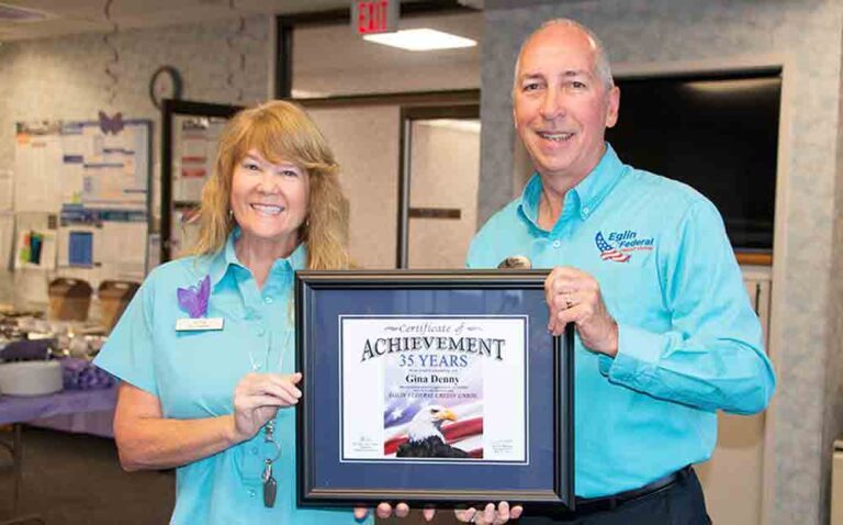 Gina Denny and Jerry Williams with award