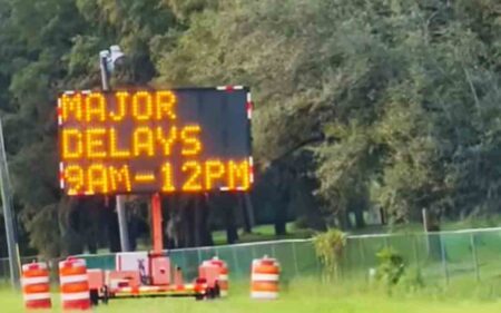 electronic sign on roadside with road closure hours