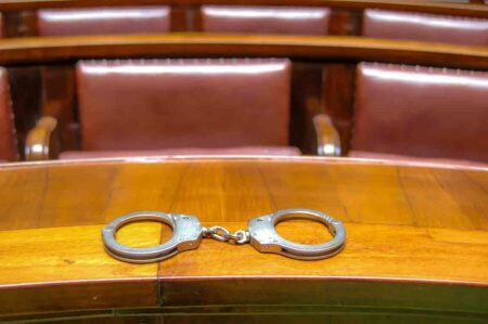 Handcuffs on the indictment bench in the courtroom