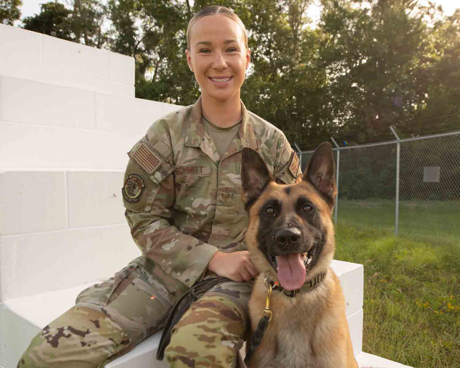 female air force dog handler with K9