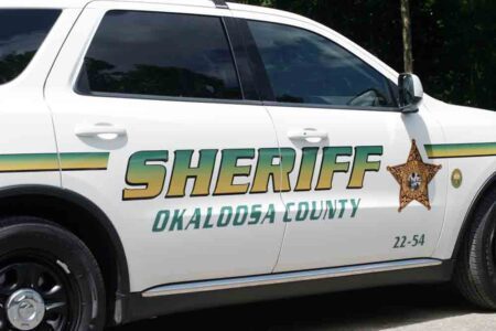 Okaloosa County Sheriff's Office vehicle, side view