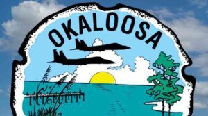 okaloosa county logo, cropped with sky background