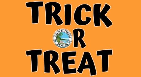 trick-or-treat in black on orange banner with city of niceville seal