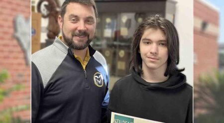 Ruckel Middle School Principal Joe Jannazo stands with Student of the Month Daniil Medvedev