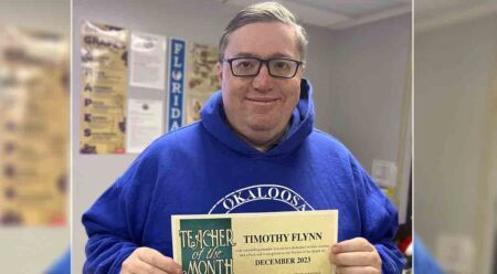 Timothy Flynn with Teacher of the Month certificate