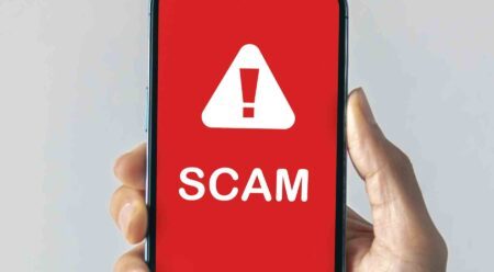 scam alert on smart phone screen