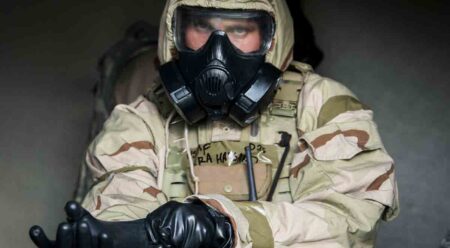 Airman putting on his protective gear