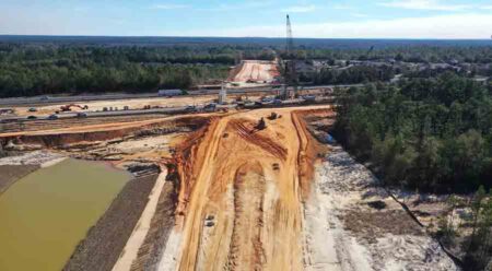 aerial view looking north at the I-10/P.J. Adams Parkway interchange construction project
