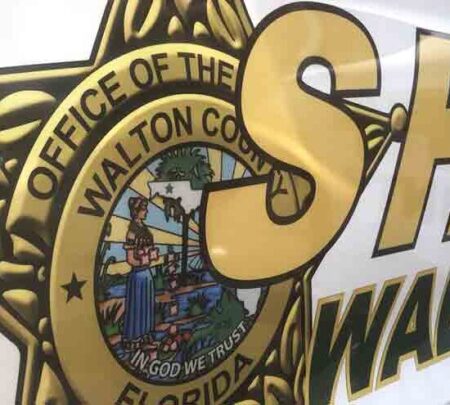 Close-up of the Walton County Sheriff’s Office emblem on a patrol vehicle.