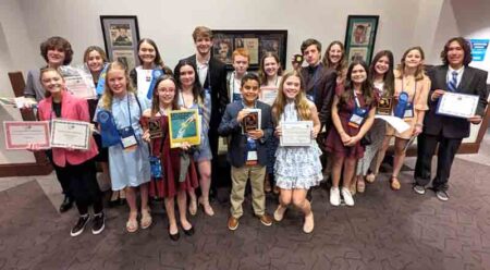18 students from Okaloosa County and Walton County displaying awards from 69th State Science and Engineering Fair of Florida