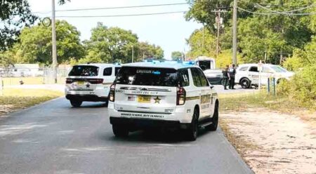 three okaloosa county sheriff's office vehicles and a pair of deputies on the scene of an arrest during the day