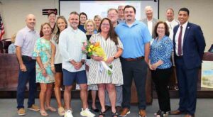 Kimberly Nihill Taylor with family, friends and school officials following her appointment as Principal of the Okaloosa STEMM Academy.