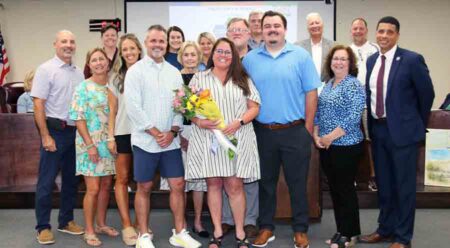 Kimberly Nihill Taylor with family, friends and school officials following her appointment as Principal of the Okaloosa STEMM Academy.