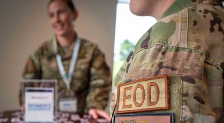 A participant in the inaugural Explosive Ordnance Women’s Leadership Summit at Eglin Air Force Base, Fla., wears the explosive ordnance disposal patch that honors Linda Cox, the first woman to attend and graduate EOD school and the first woman EOD Chief in the Air Force.