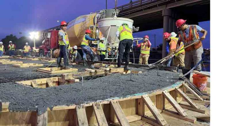 Crews constructing a seal slab for the Brooks Bridge Replacement Project after dark in Okaloosa County