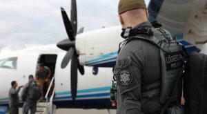 A member form the National Icelandic Police prepares to embark on a C-146A Wolfhound