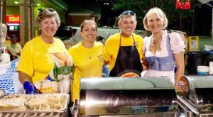 Four women standing ready to serve up food at the Oktoberfest in Bluewater Bay, Niceville, Florida.