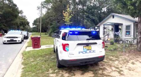 Okaloosa County Sheriff's Office and Crestview Police Department vehicles on the scene of a narcotics search warrant