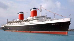 Color-optimized historic image of the SS United States near shore.