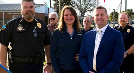 Niceville city officials and law enforcement stand together at the launch of the speed camera program near CW Ruckel Middle School.