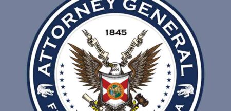 Close-up of the Florida Attorney General’s seal with an eagle and state symbols.