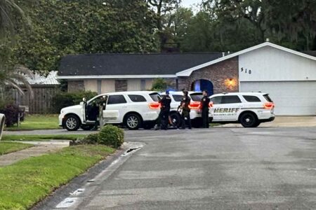 Deputies from the Okaloosa County Sheriff’s Office outside a home on Sioux Circle