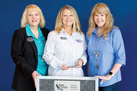 Johna Jones holds 5-Star Performer award alongside Cathie Staton and Gina Denny