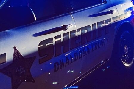 Okaloosa County Sheriff’s Office patrol vehicle with logo at night