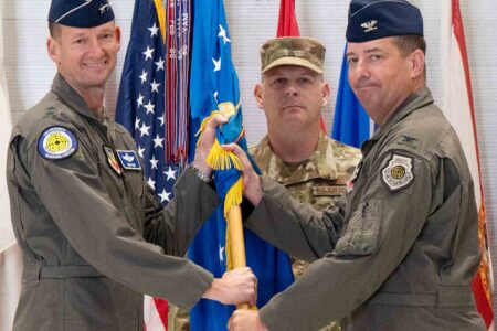 Maj. Gen. Christopher Niemi passes the guidon to Col. Daniel Lehoski during change of command ceremony